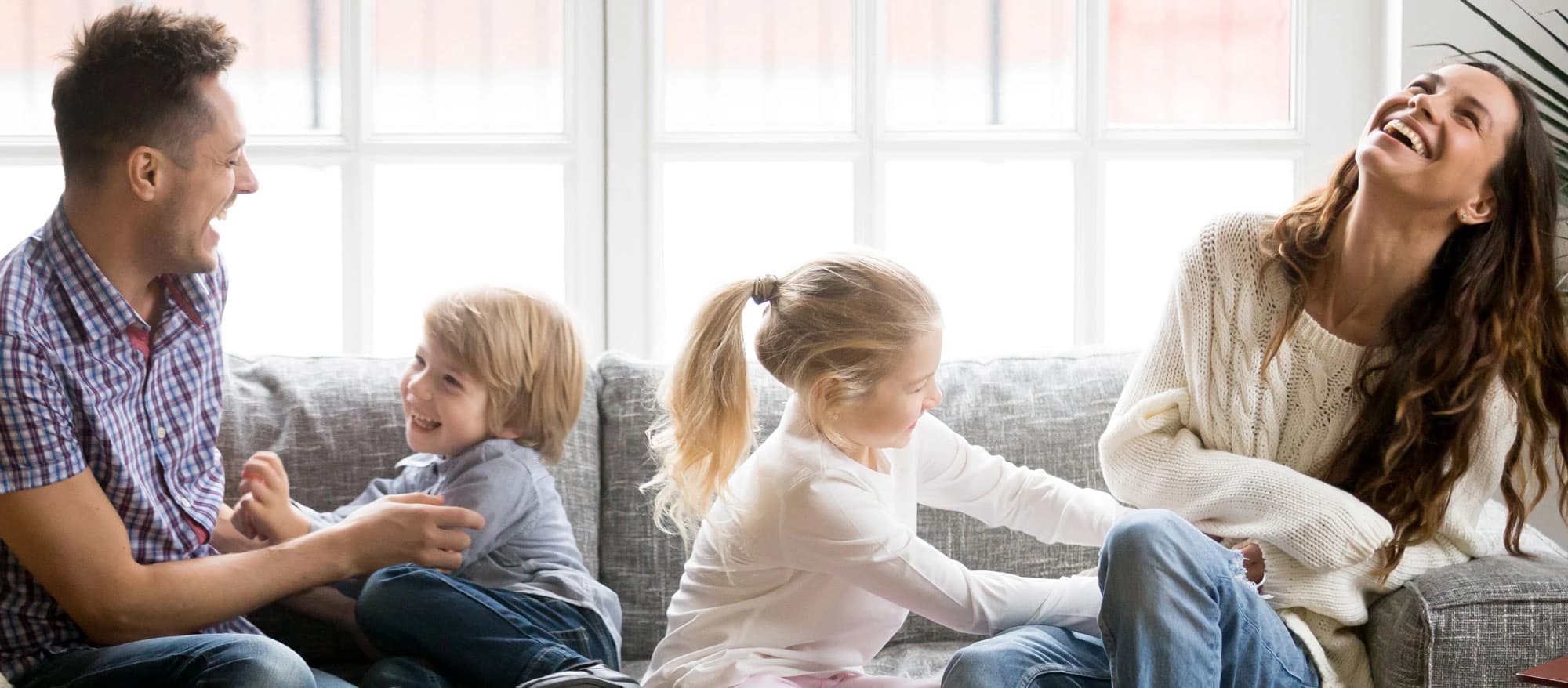 Family enjoying success on couch